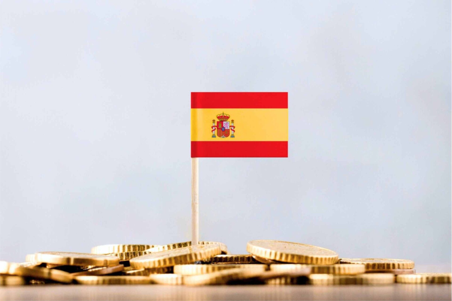 Bandera española con monedas