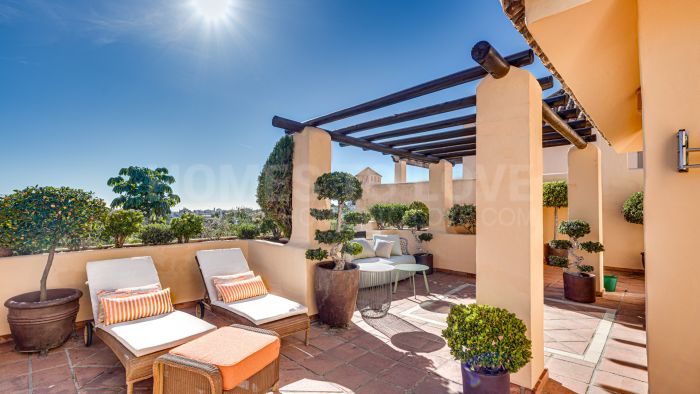 Mediterranean-style duplex penthouse with multiple terraces and a rooftop terrace with a private sauna and barbecue area